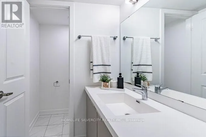 104 - 3058 SIXTH LINE