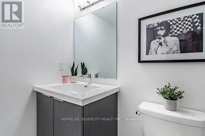 104 - 3058 SIXTH LINE