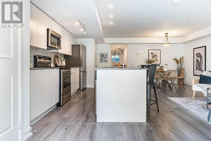 104 - 3058 SIXTH LINE