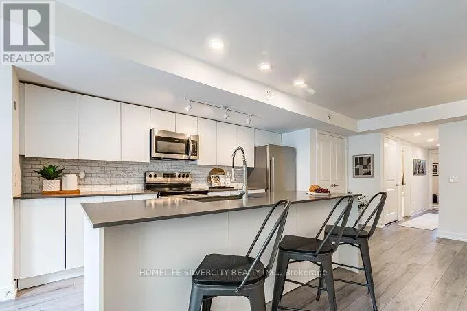 104 - 3058 SIXTH LINE