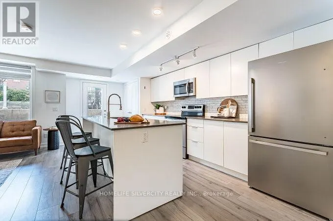 104 - 3058 SIXTH LINE