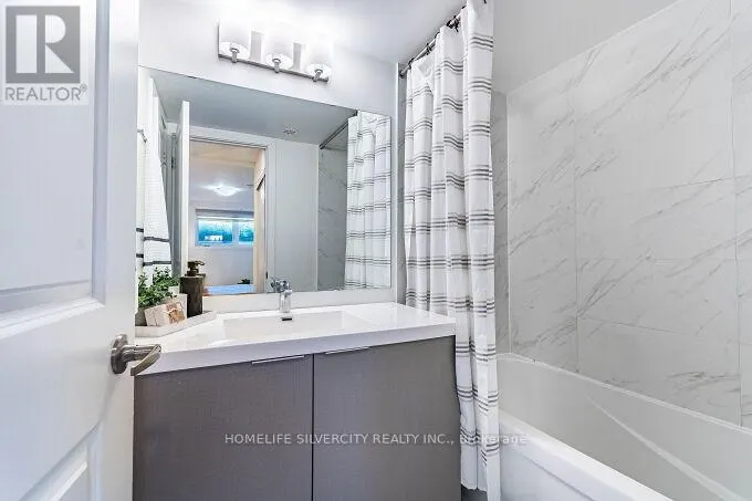 104 - 3058 SIXTH LINE