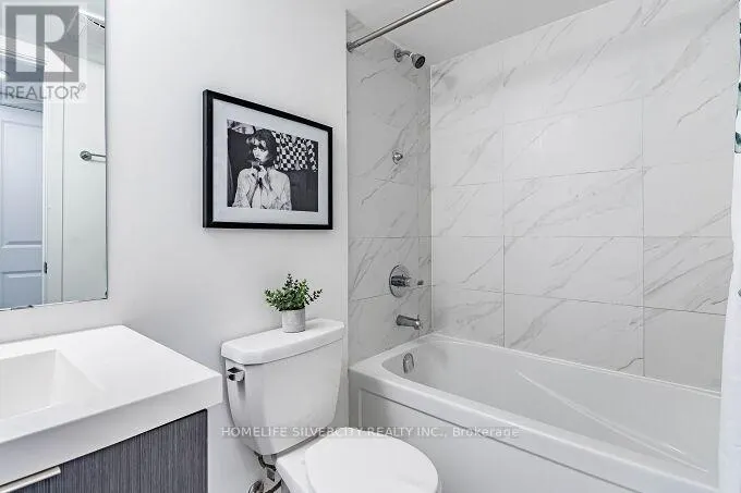 104 - 3058 SIXTH LINE