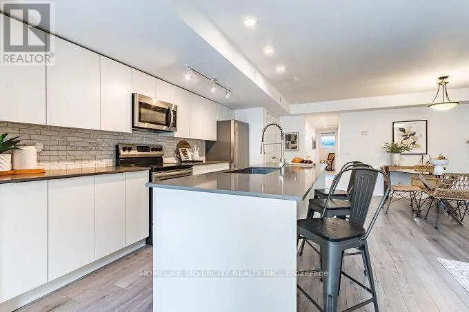 104 - 3058 SIXTH LINE