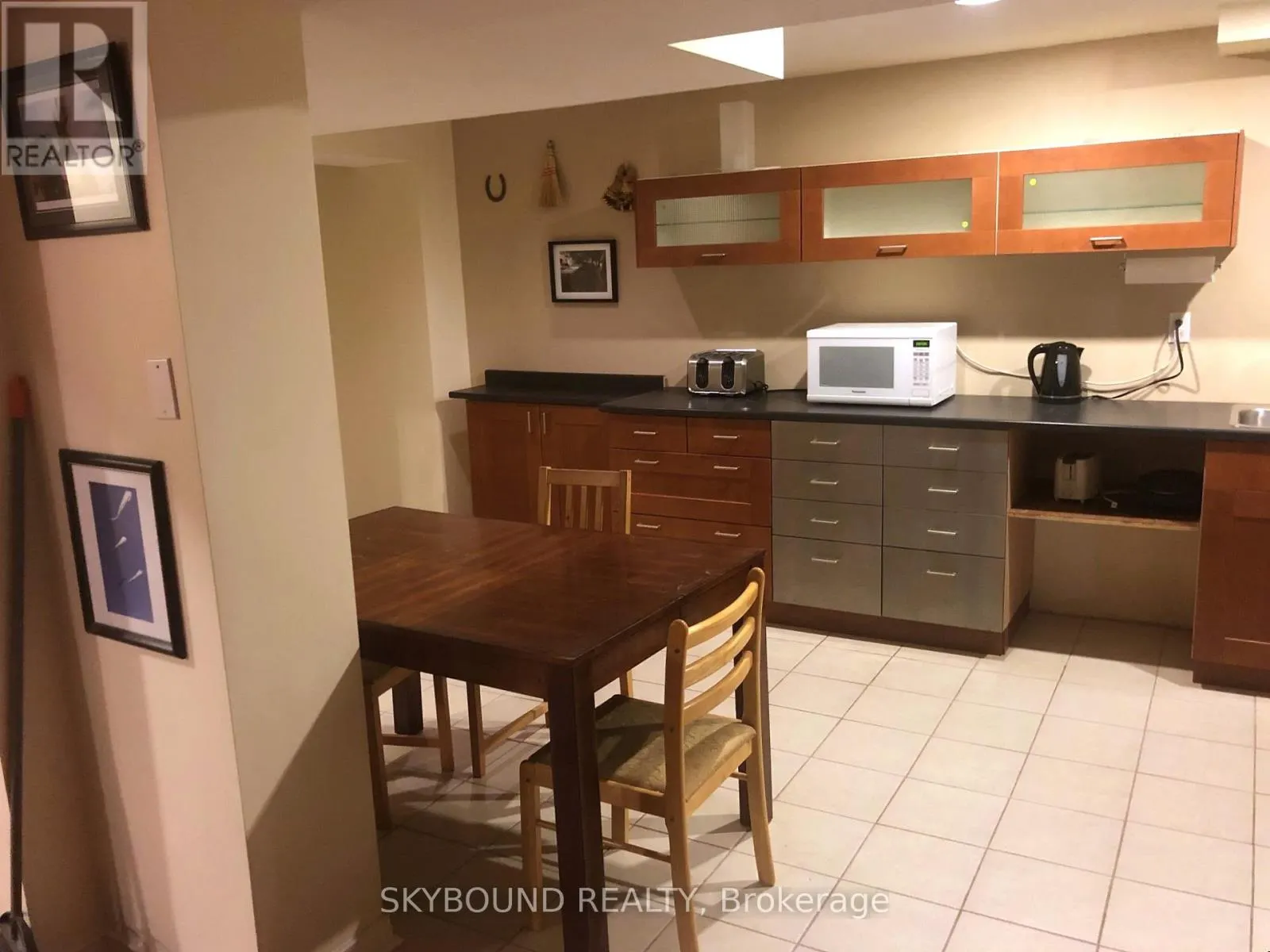 BASEMENT APARTMENT - 4833 WILD ROSE STREET