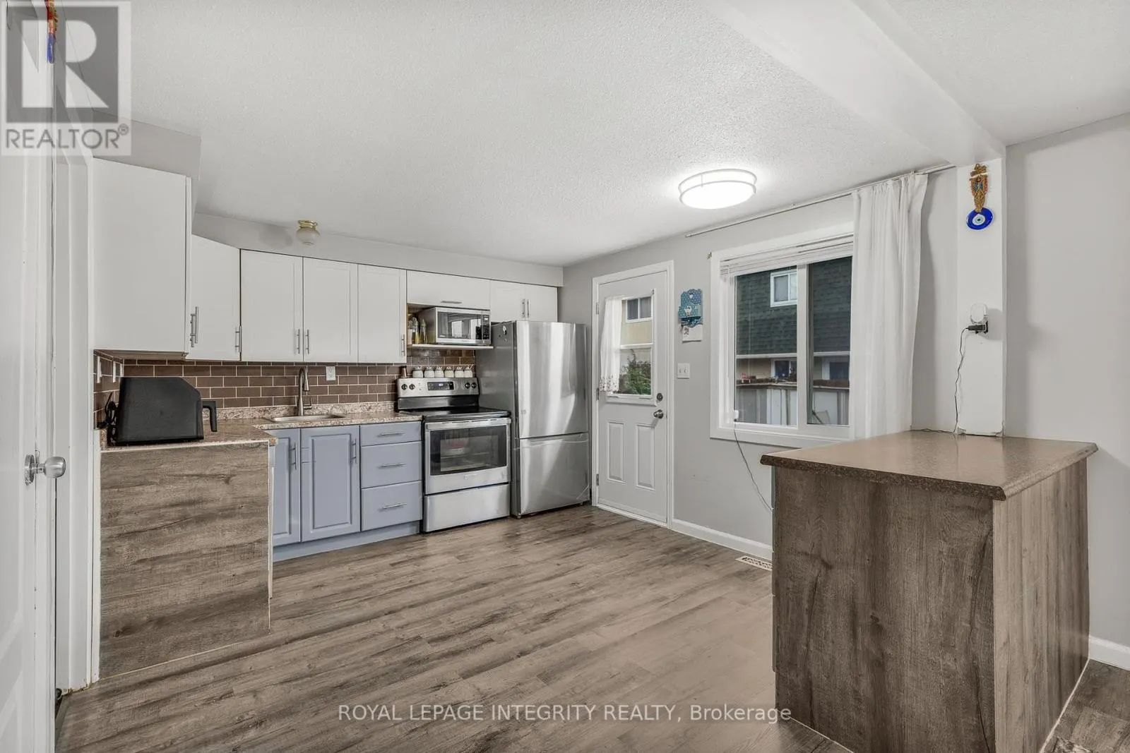 107 - 1548 BEAVERPOND DRIVE