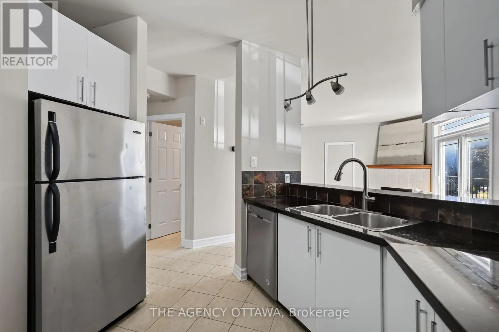 203 - 711 CHURCHILL AVENUE N