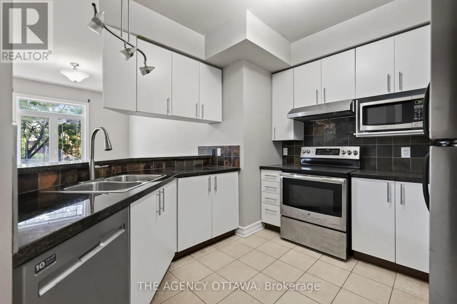 203 - 711 CHURCHILL AVENUE N