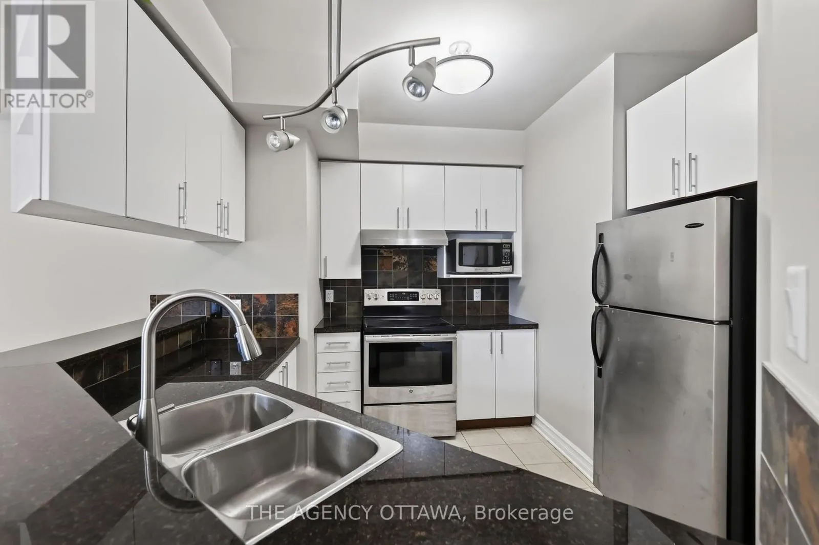 203 - 711 CHURCHILL AVENUE N