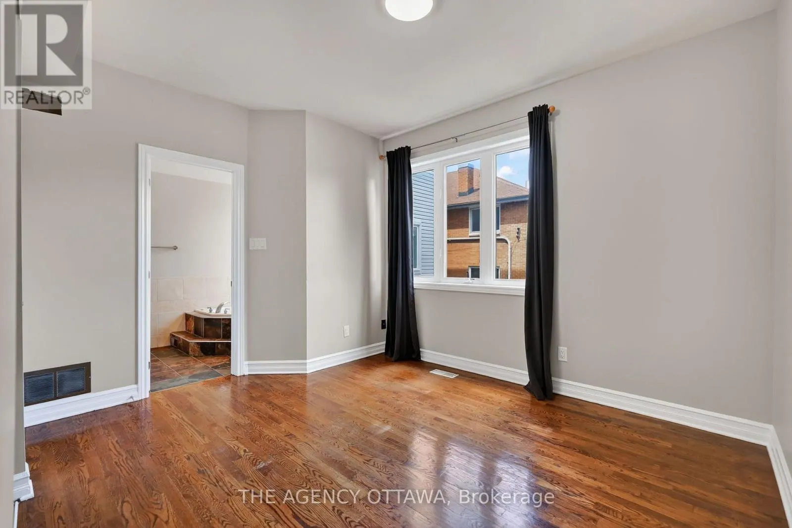 203 - 711 CHURCHILL AVENUE N