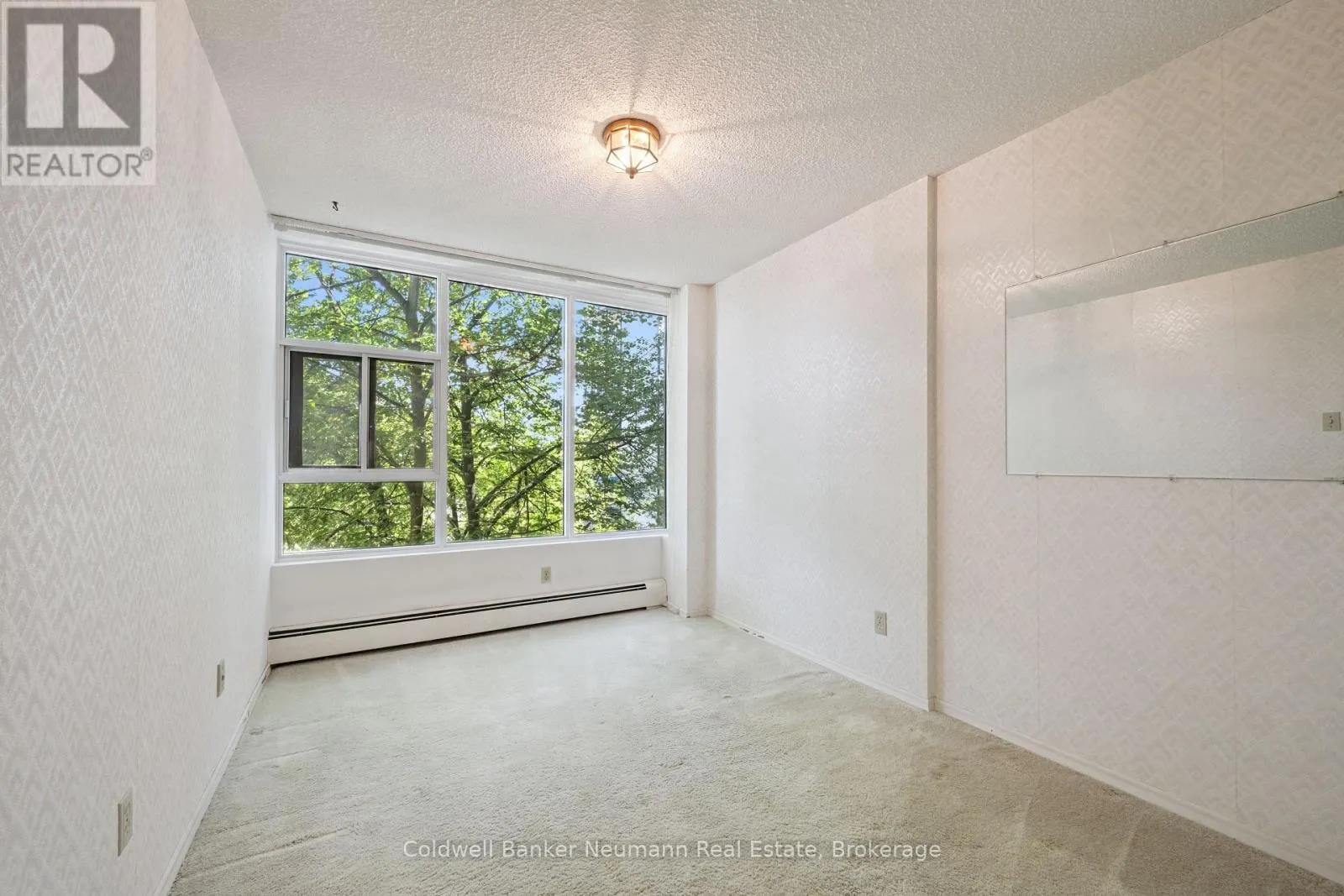 305 - 23 WOODLAWN ROAD E #305