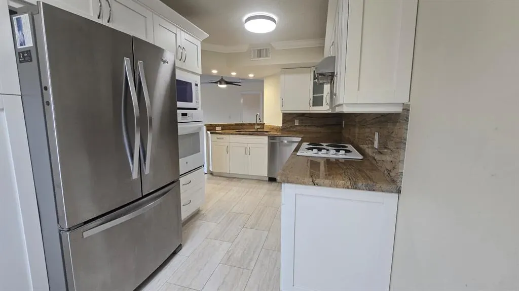 8871 WILES ROAD, #202
