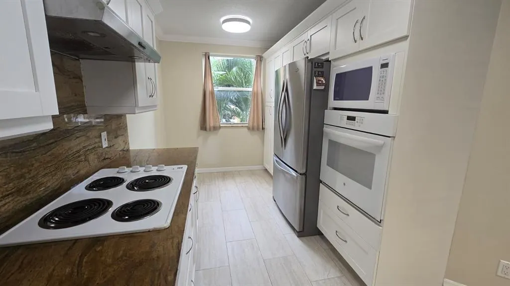 8871 WILES ROAD, #202