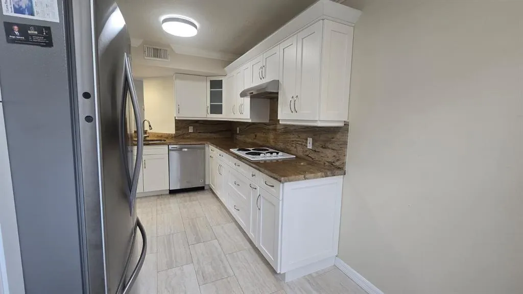 8871 WILES ROAD, #202