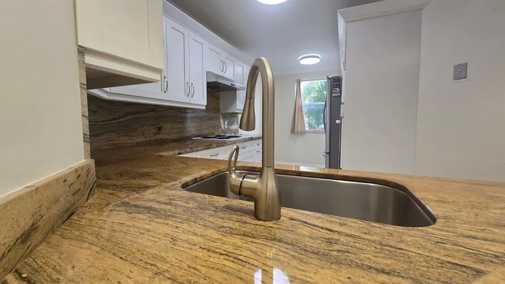 8871 WILES ROAD, #202