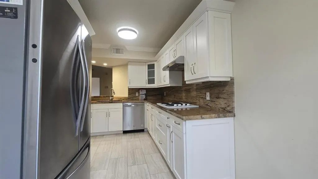 8871 WILES ROAD, #202