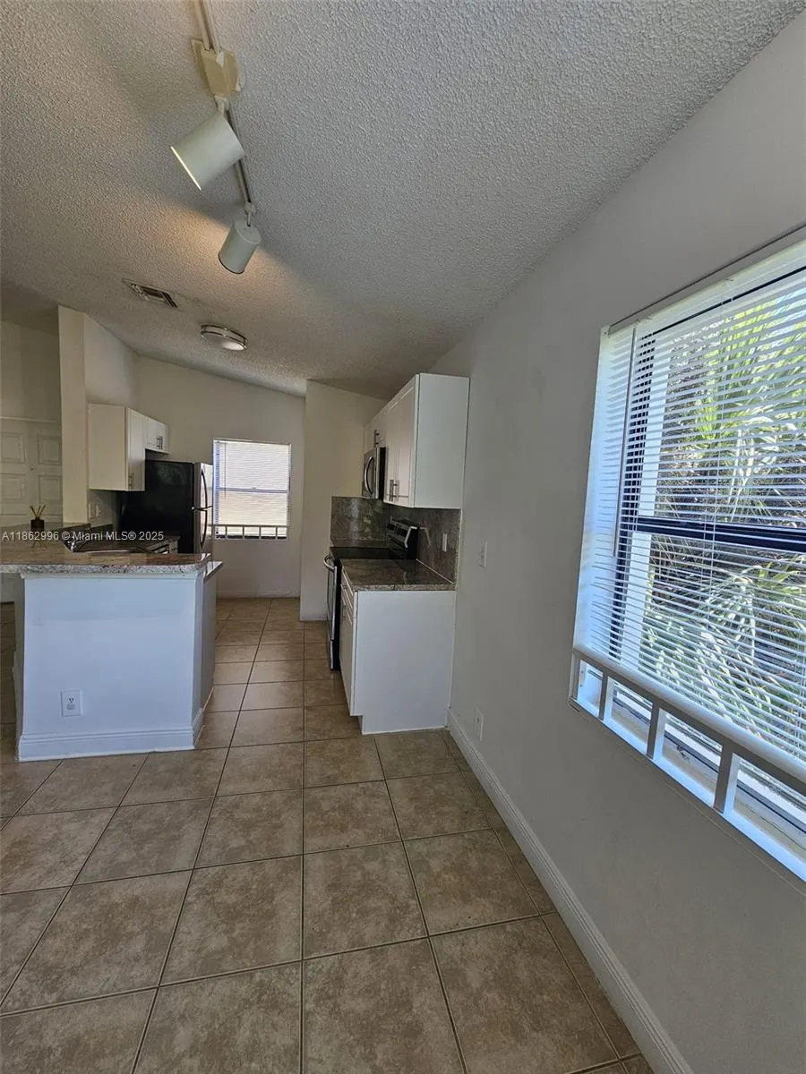 9999 Summerbreeze Dr, #215