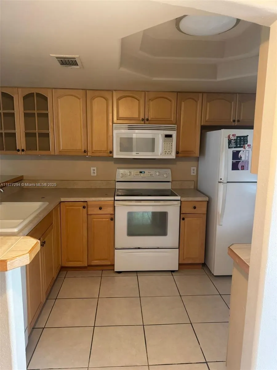 5040 terrace Palms circle, #202