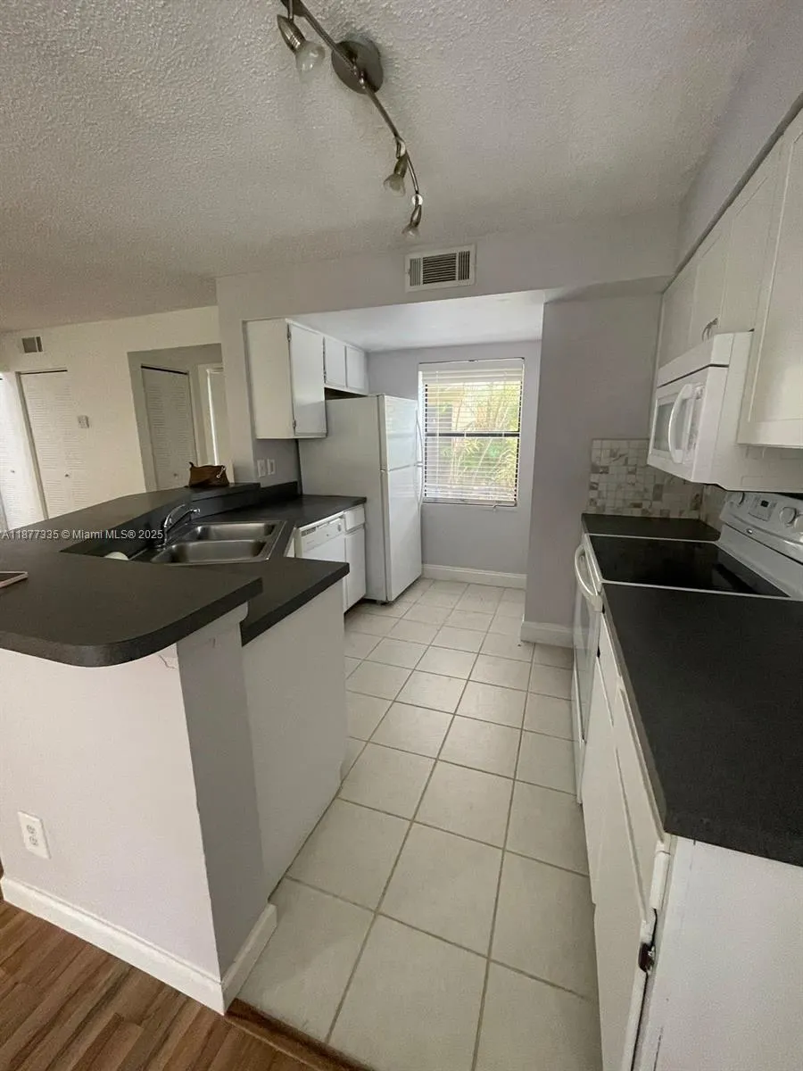 9999 Summerbreeze Dr, #413