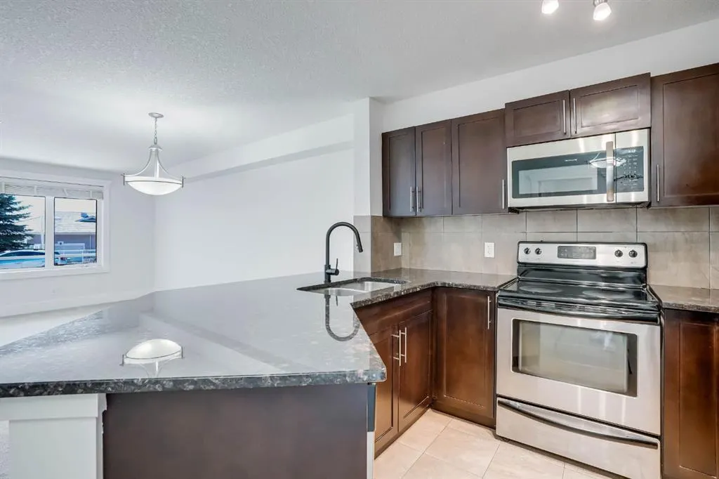 500 Rocky Vista Gardens NW, #103