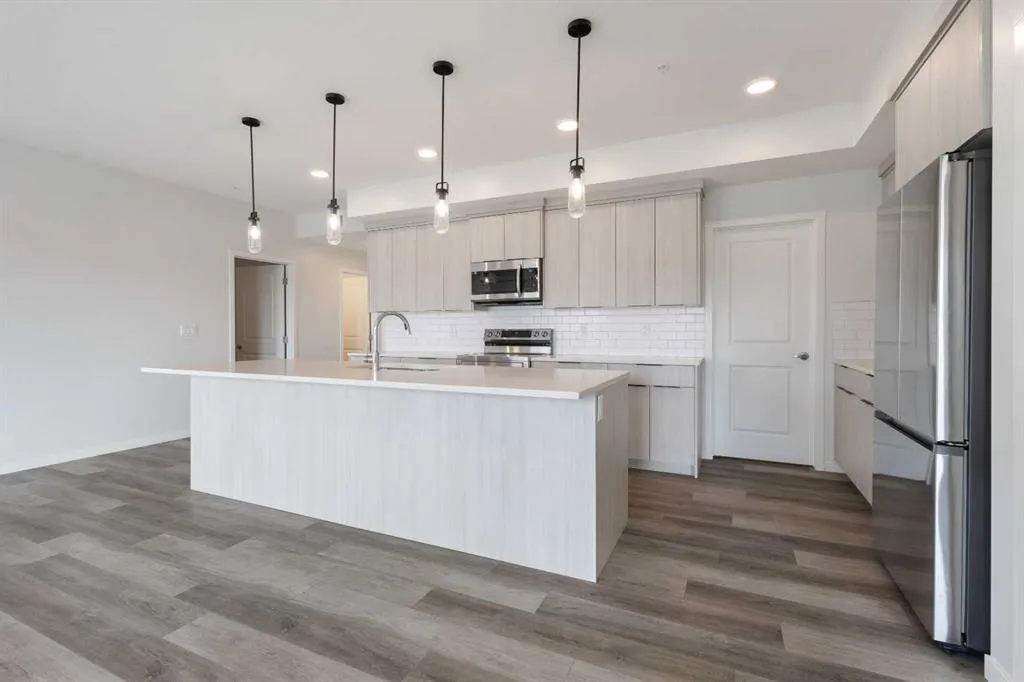 360 HEARVEST HILLS Way NE, #306