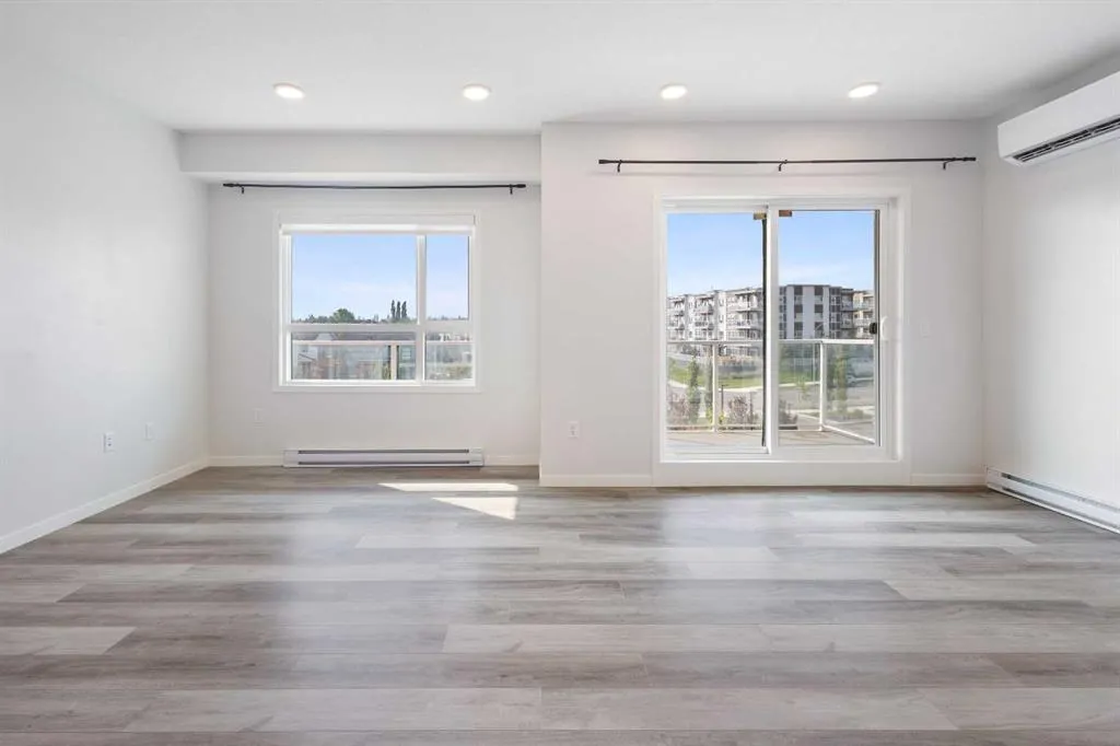 360 HEARVEST HILLS Way NE, #306