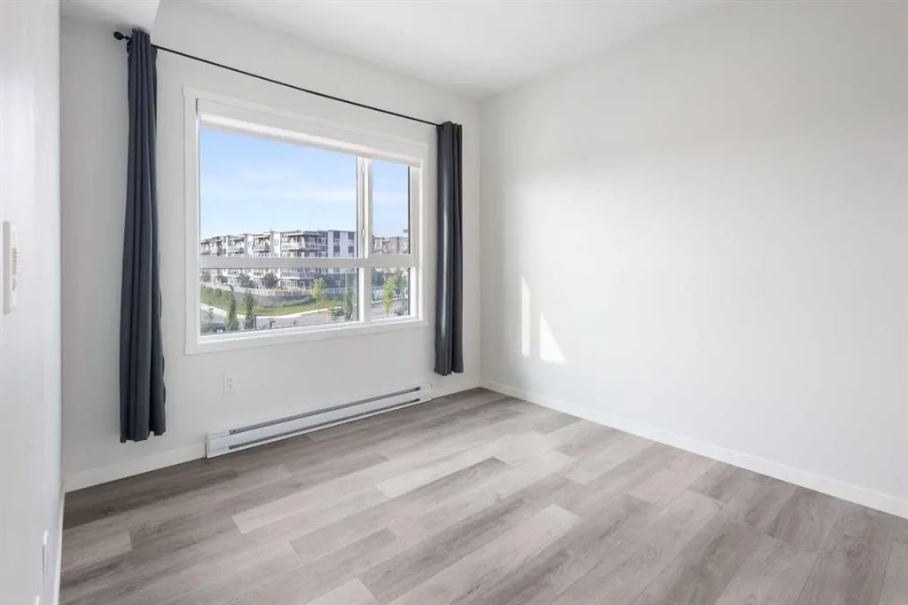 360 HEARVEST HILLS Way NE, #306