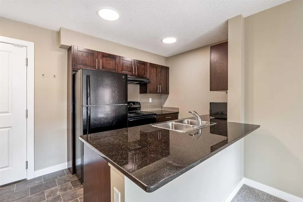 403 Mackenzie Way SW, #1407