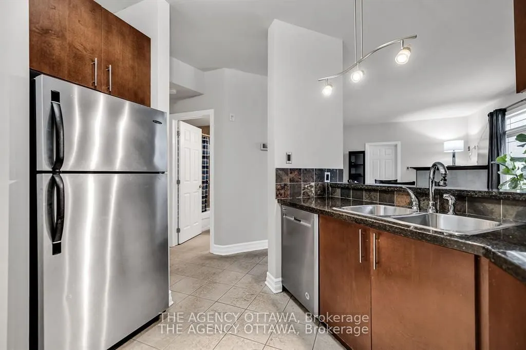 711 CHURCHILL Avenue N #203