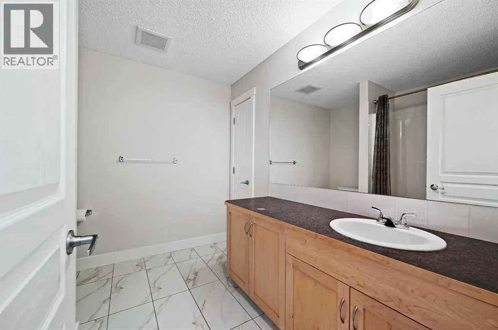 1212, 211 Aspen Stone Boulevard SW