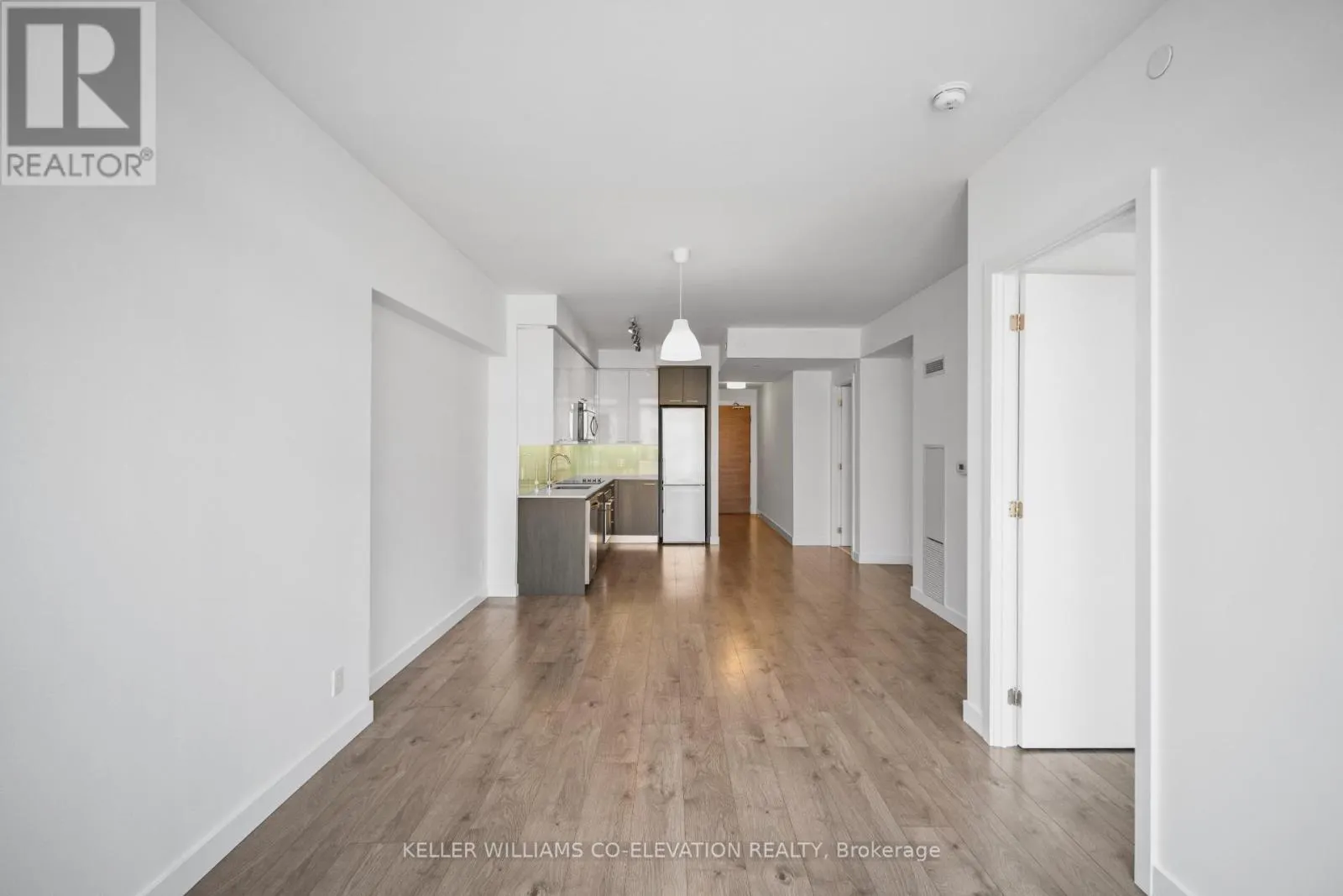 303 - 1075 QUEEN STREET E