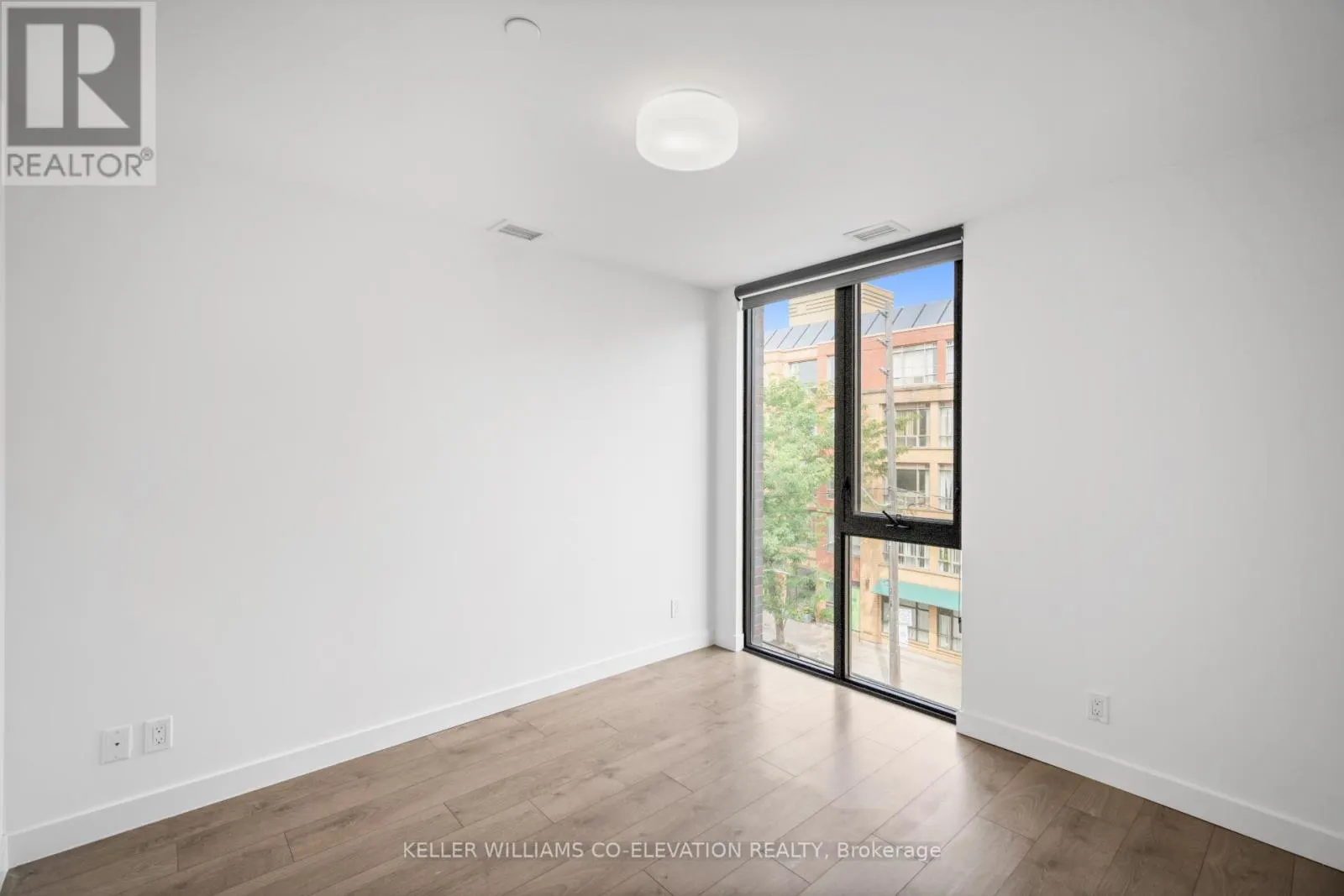 303 - 1075 QUEEN STREET E