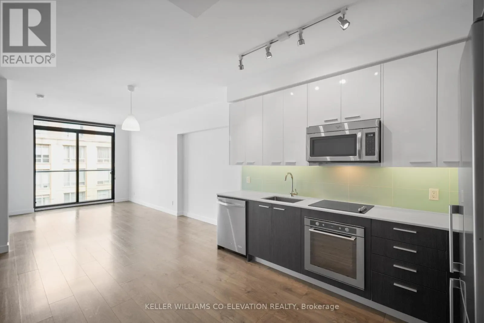 303 - 1075 QUEEN STREET E