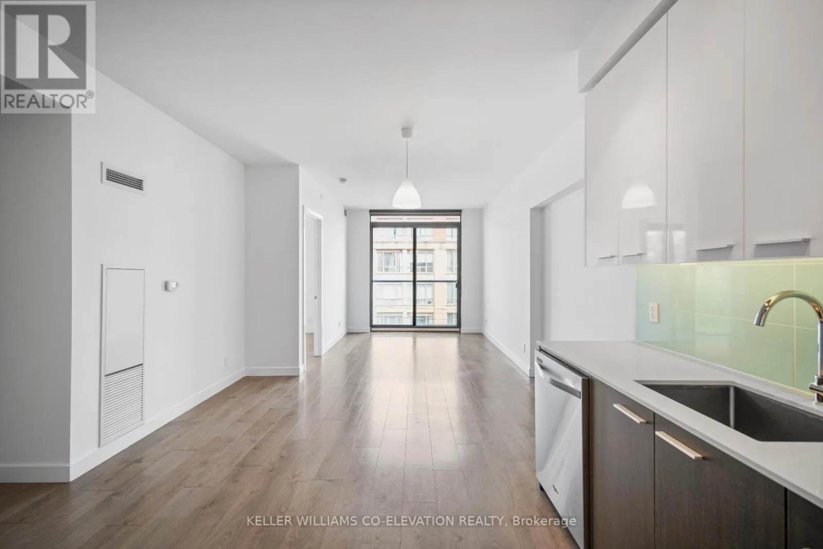 303 - 1075 QUEEN STREET E