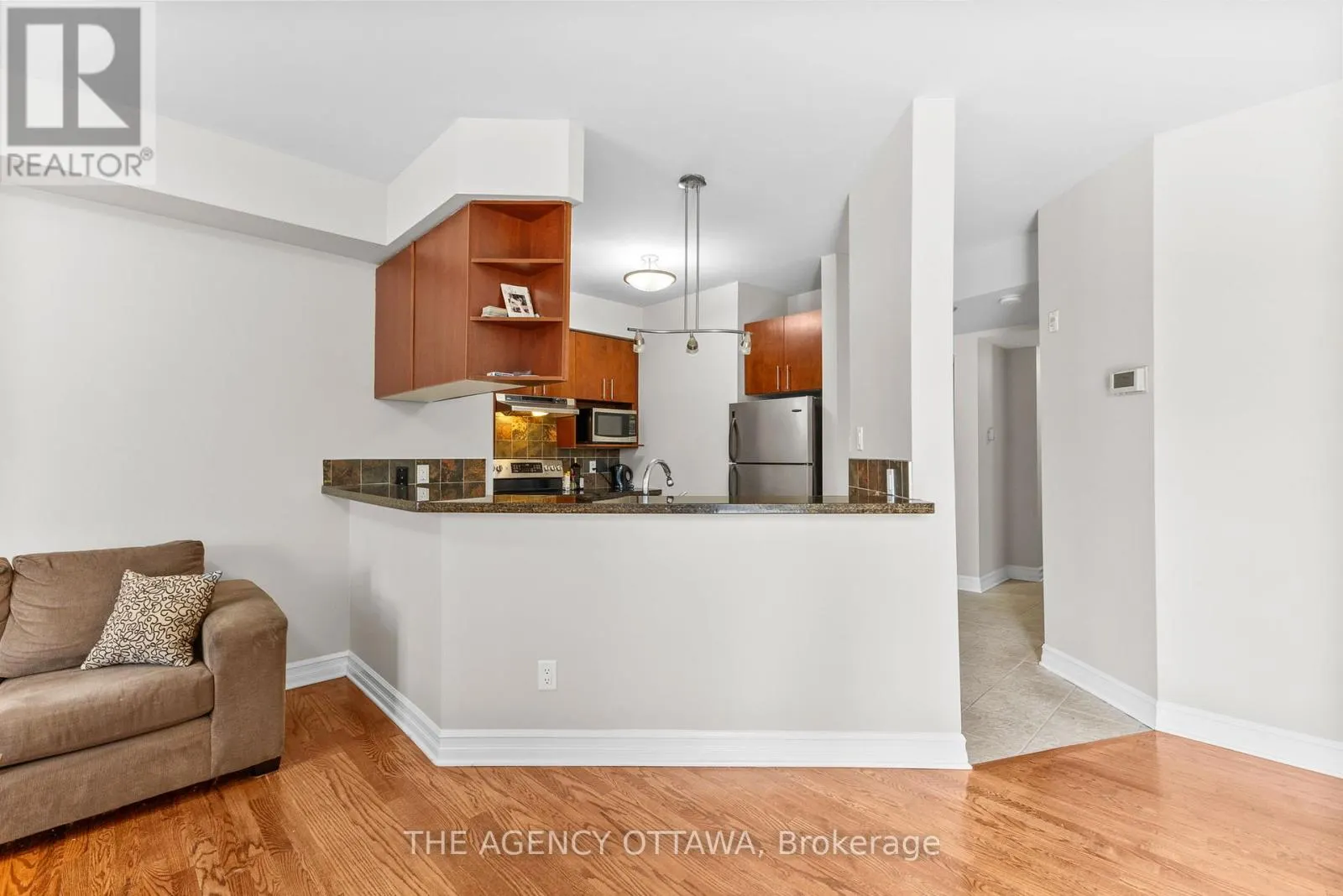 203 - 711 CHURCHILL AVENUE N