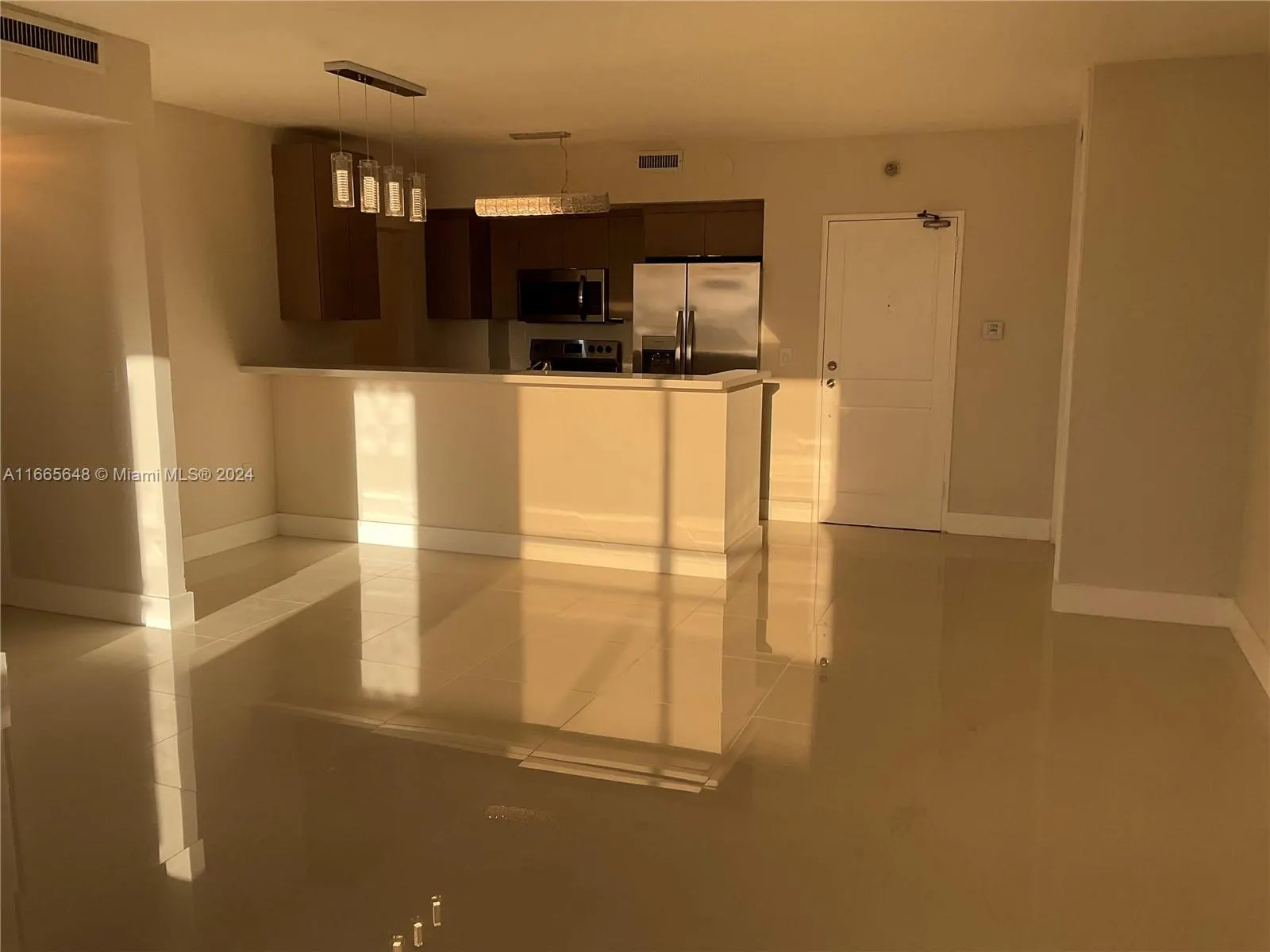 10185 Collins Ave, #406